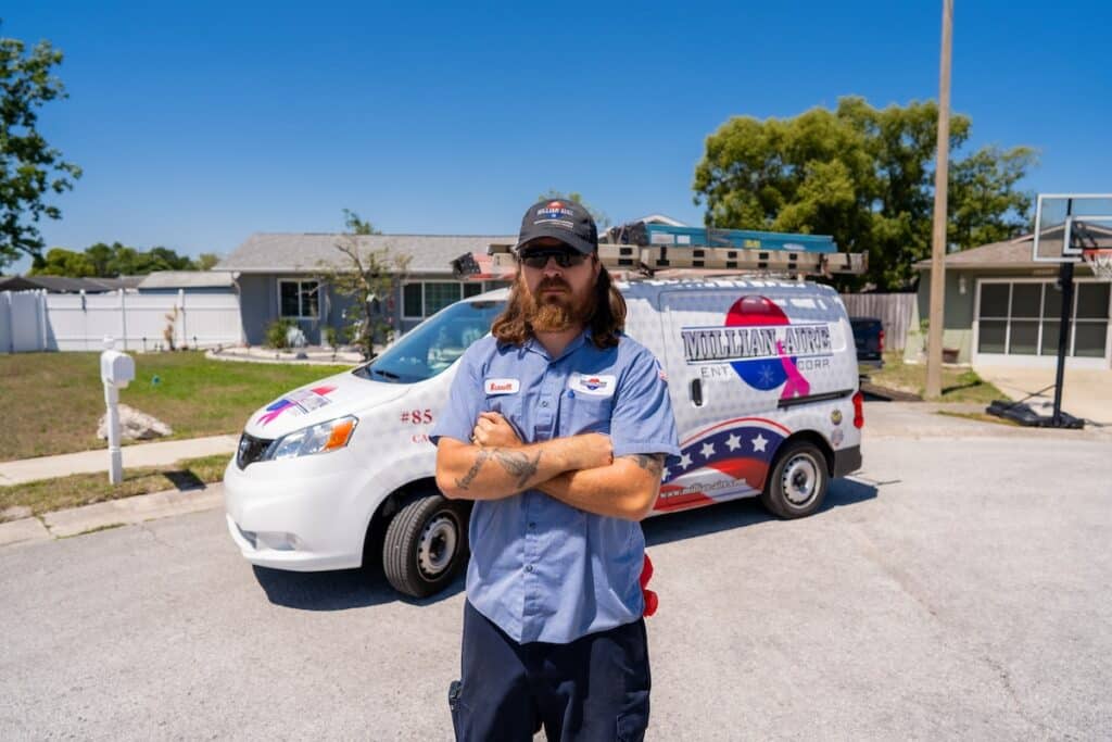 Millian Aire Technician working on a hvac system in Dunedin Florida